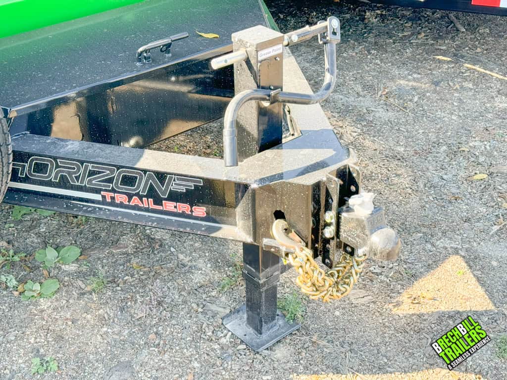 Horizon Lime Green and Black HD Dump Trailer parked at Brechbill Trailers.