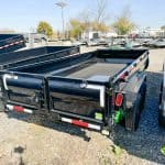 A new black Horizon 14k Heavy Duty dump trailer parked in the Brechbill Trailers lot