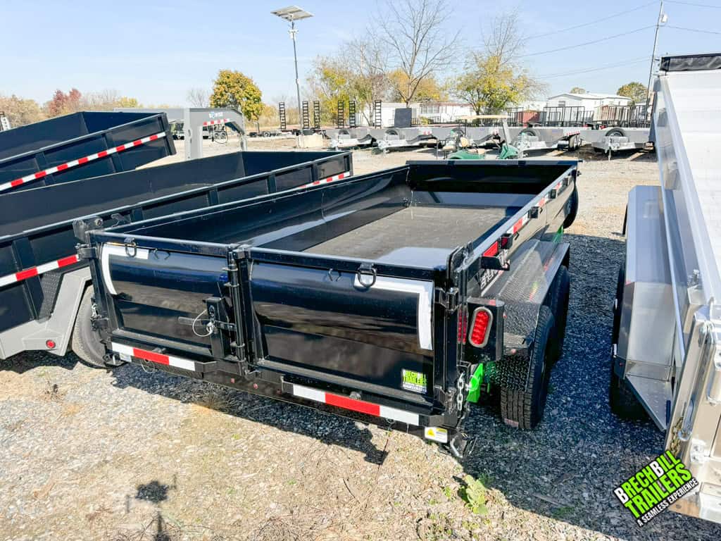 A new black Horizon 14k Heavy Duty dump trailer parked in the Brechbill Trailers lot