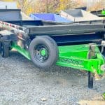The front of a lime green and black 16ft Horizon dump trailer