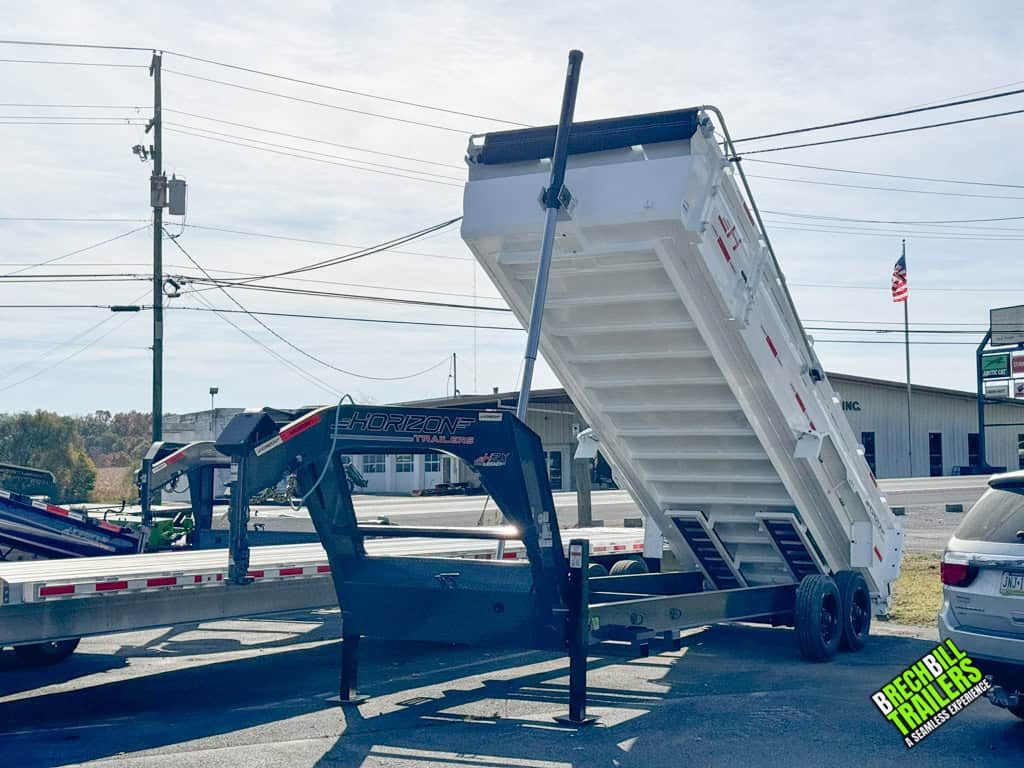20ft Horizon HD Gooseneck Dump Trailer raised in the dumping position for a demonstration
