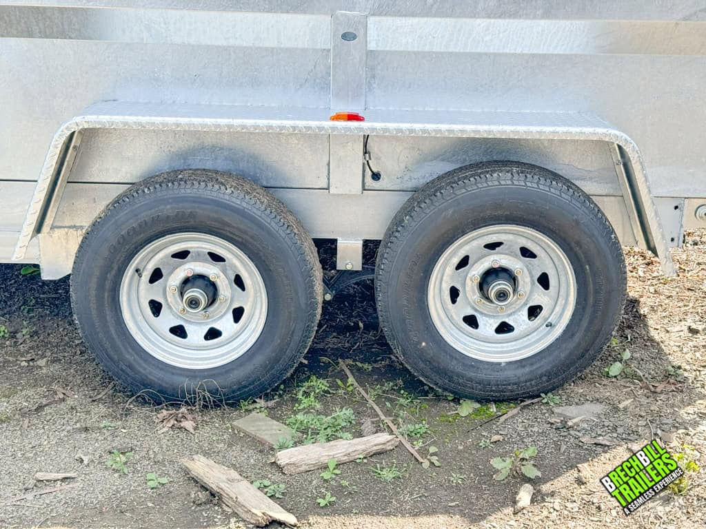 Wheels on a galvanized Bwise LP LE 10K Low Pro Dump Trailer