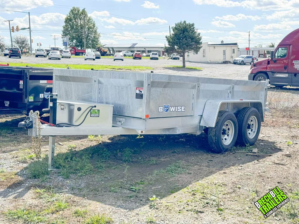 A parked 6x12 galvanized low pro dump trailer for sale.