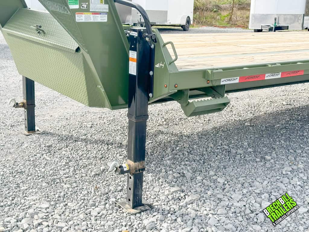 Dual jacks holding the parked Horizon 26ft Deck Over Gooseneck Trailer
