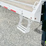 Cloudy gray colored gooseneck trailer.