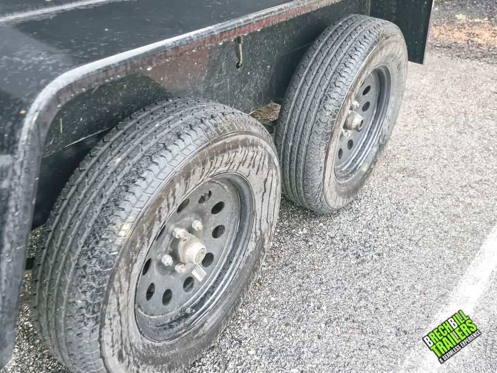Wheels on the dual axle dump trailer.