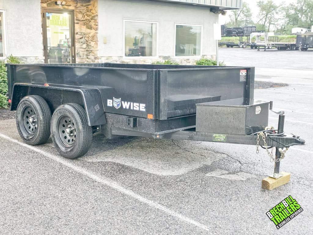 A black 10ft long Used Bwise R Series 7K Dump Trailer .