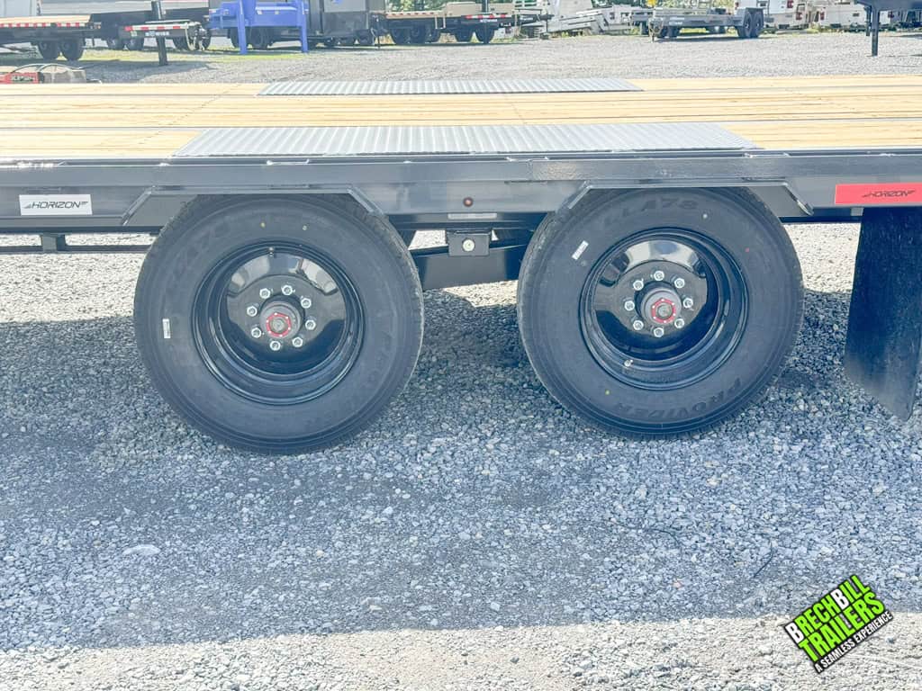 New wheels on the Horizon 30ft deck over gooseneck trailer.