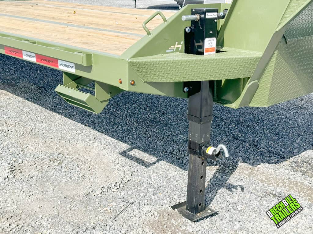 Jack holding up trailer in the parking lot.