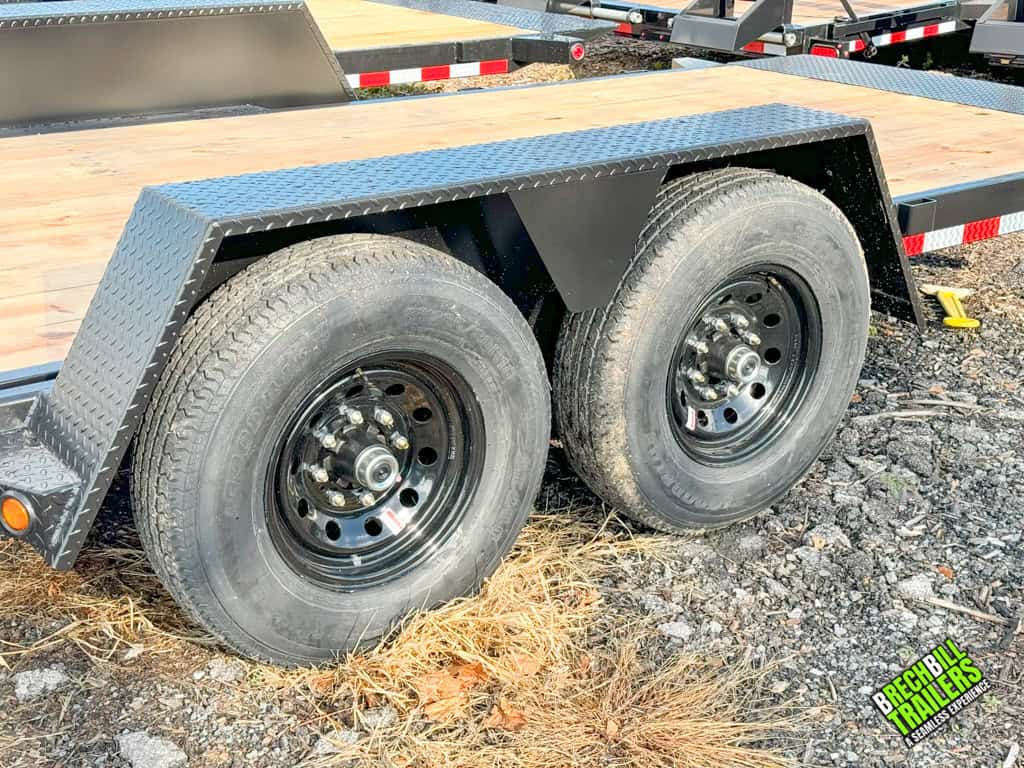 Close up view of wheels on the Bwise TG20-15 gravity tilt deck trailer