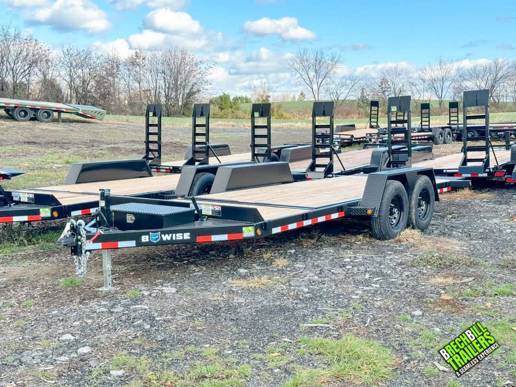 A few Bwise TG20-15 tilt deck trailers lined up at the Brechbill Trailers yard