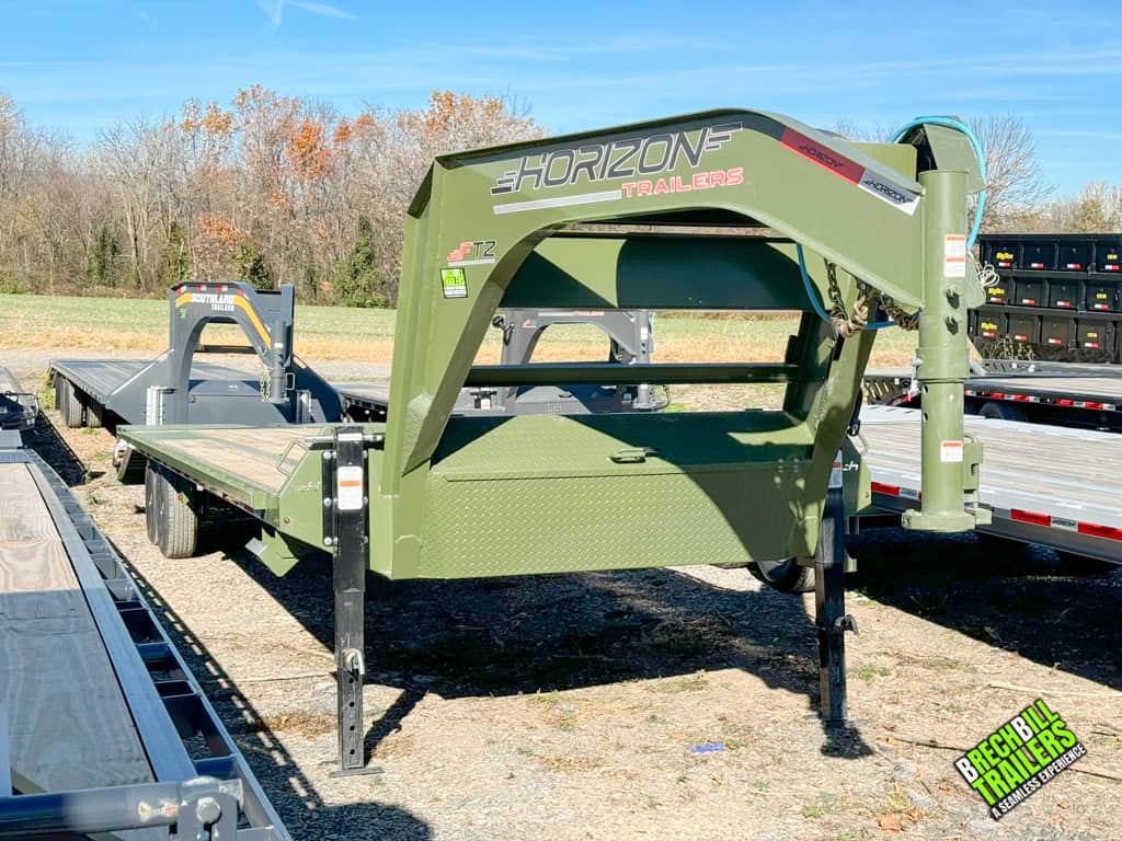 Green hitch and frame Horizon trailer parked at Brechbill Trailers dealership