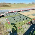 Green mega ramps on a 30ft long gooseneck trailer