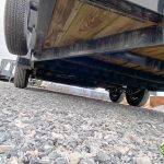 Under a USED Bwise LP LE Low Pro Dump Trailer