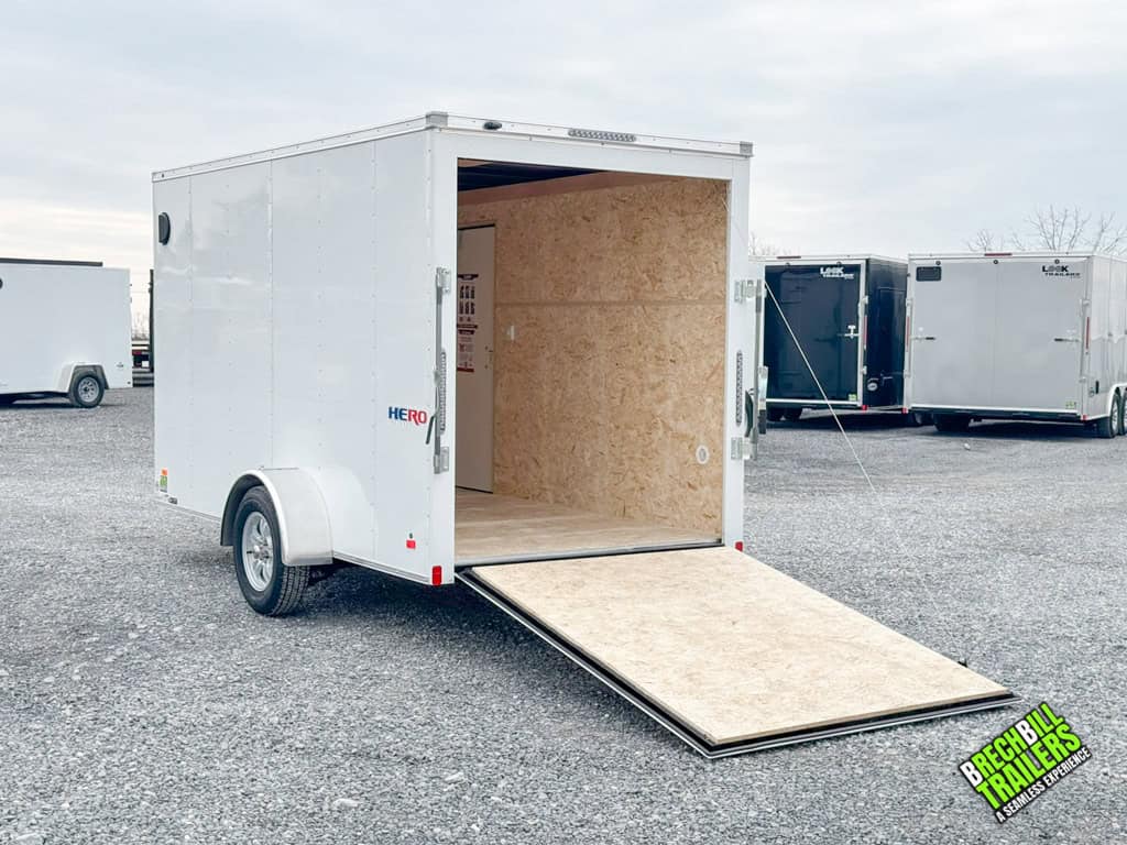 Ramp door open and looking in a Bravo Hero 3K Enclosed Cargo Trailer