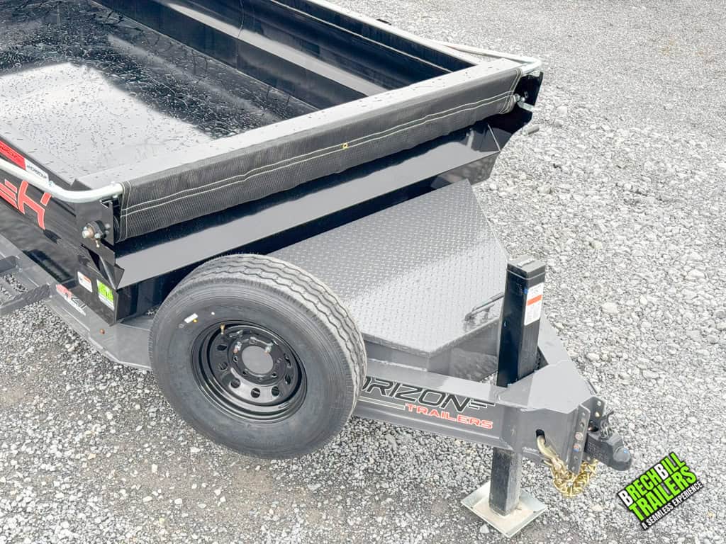 Spare tire mounted near the jack