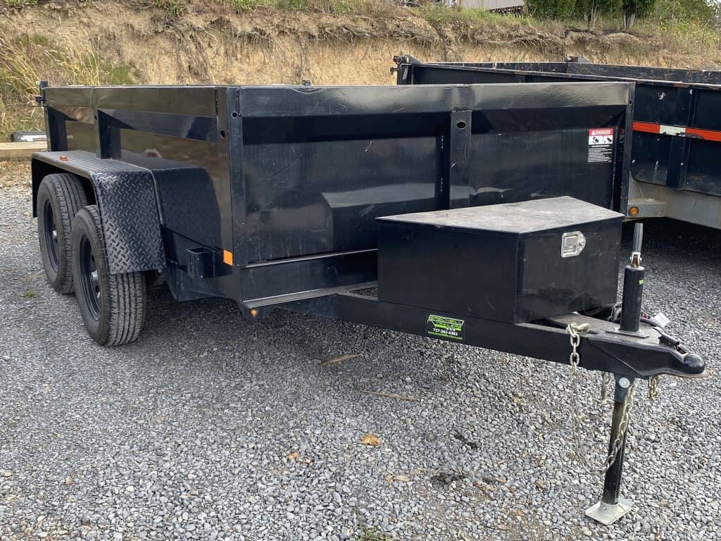 A used Bwise dump trailer for sale in the parking lot