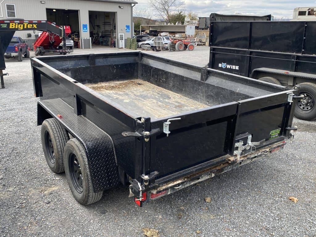 A USED Bwise LP LE 7K Low Pro Dump Trailer at the Brechbill Trailers parking lot