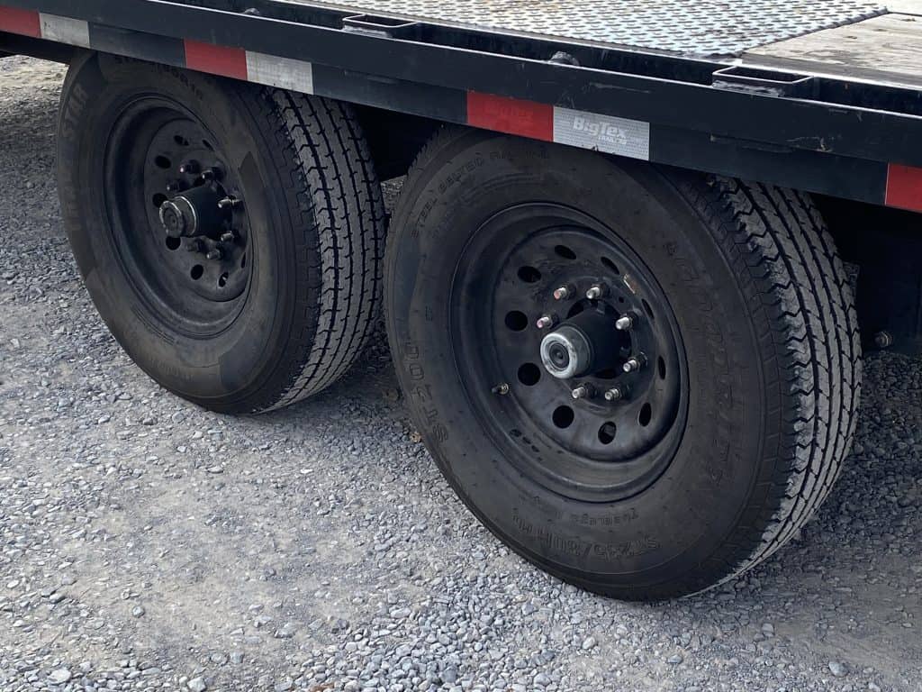 Black wheels on the USED Big Tex 16K Single Wheel Tandem Axle Gooseneck Trailer