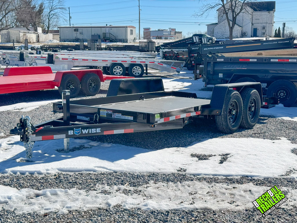 A lot full of trailers and a Bwise Low Pro gravity tilt trailer sits in the center