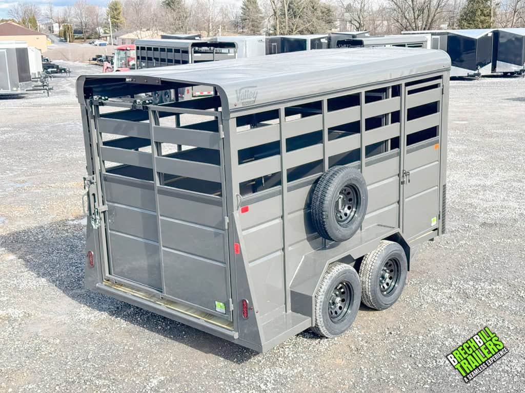 Back corner view of the trailer showing right side with spare wheel and side door