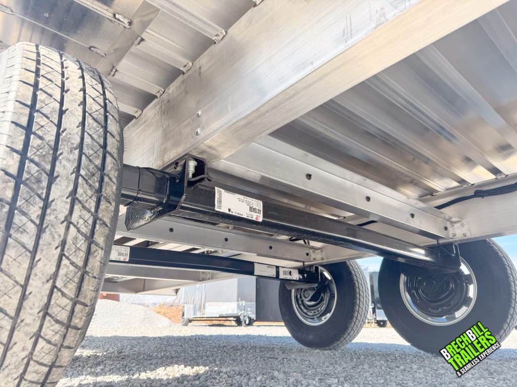 Underneath the EBY deck over trailer with a full view of axles, frame and crossmembers.