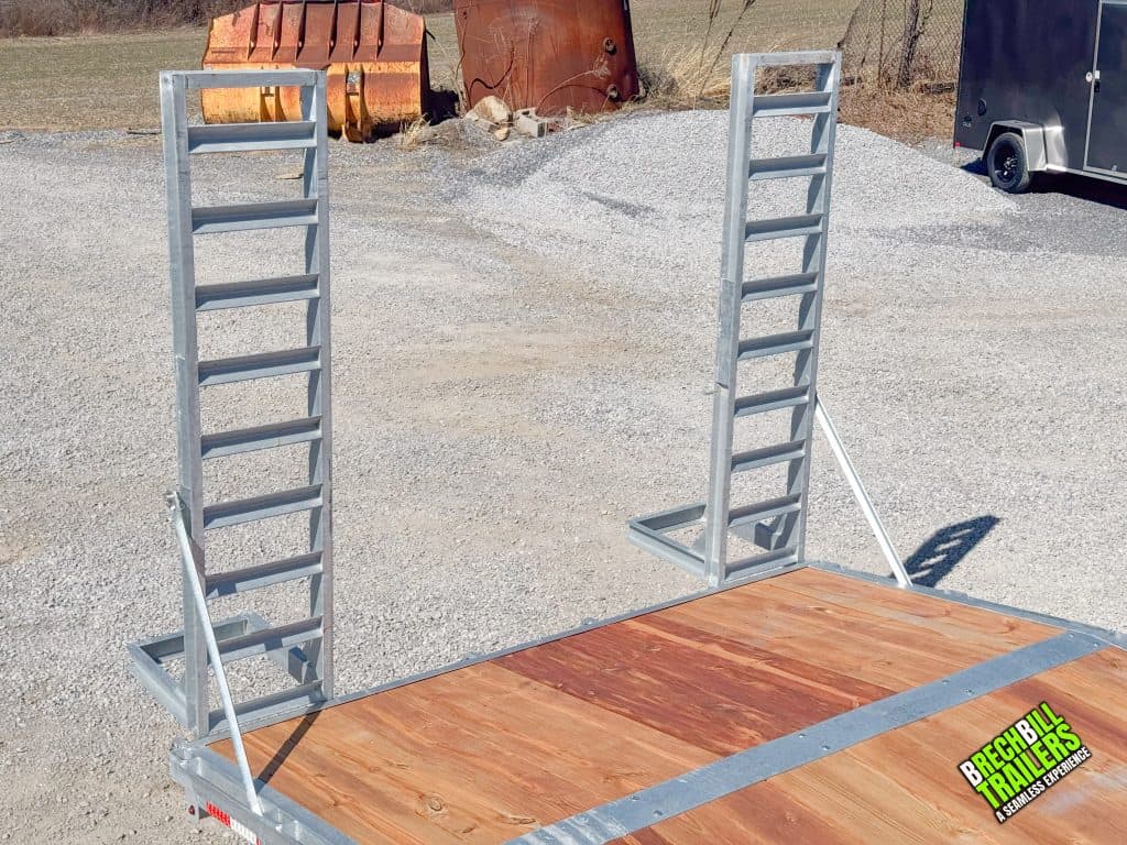 Ramps folded up on the back of the trailer.