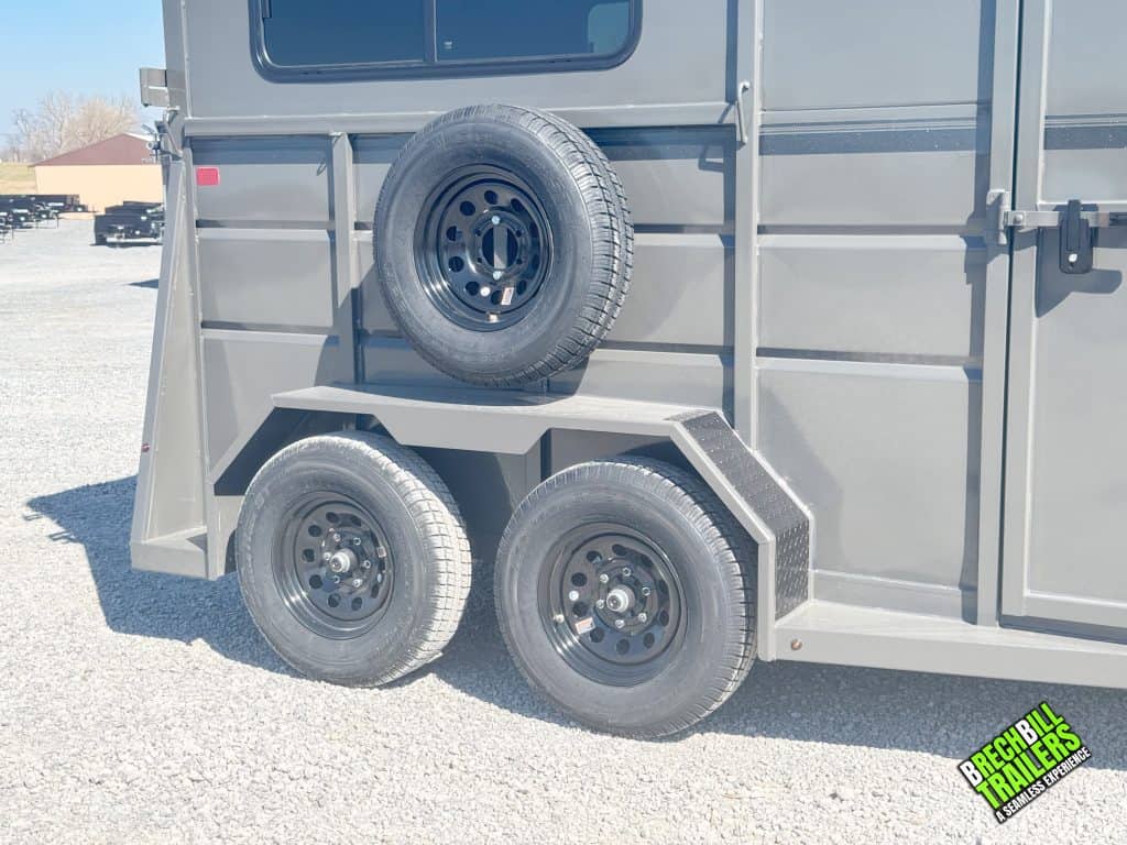Black wheels and a spare wheel mounted above them